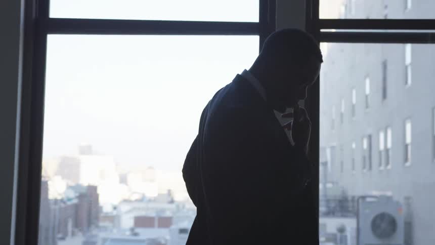A man walks past the windows