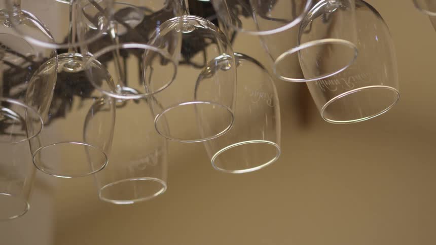 The glasses hang from a rack