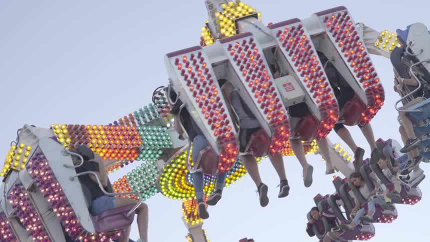 Lights flash on a full carnival ride