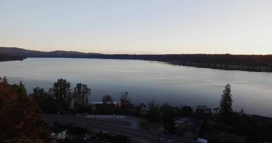 The lake is calm at sunset