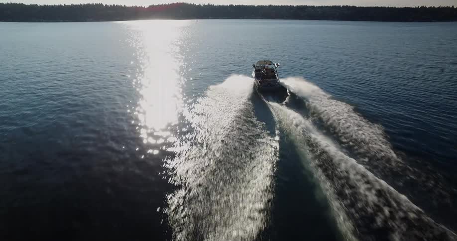A speed boat travels in the water