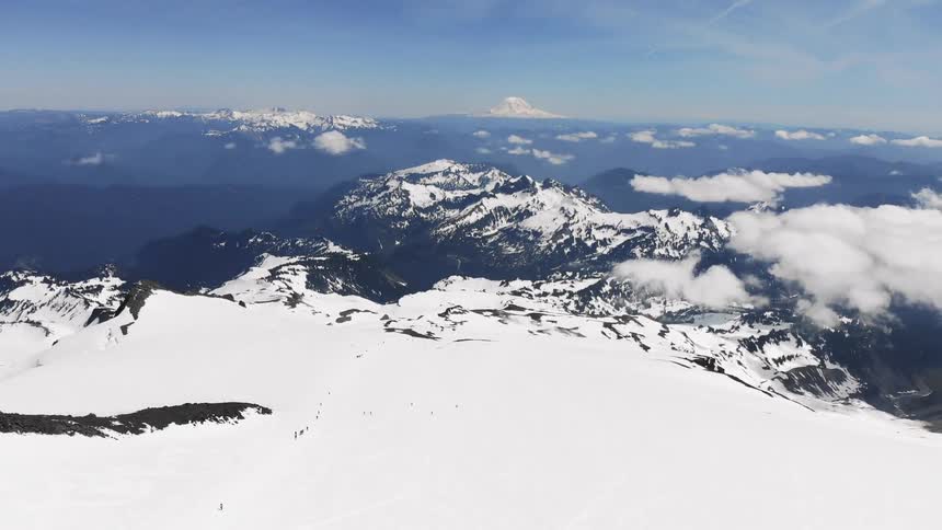 Snow covered mountains under a blue sky