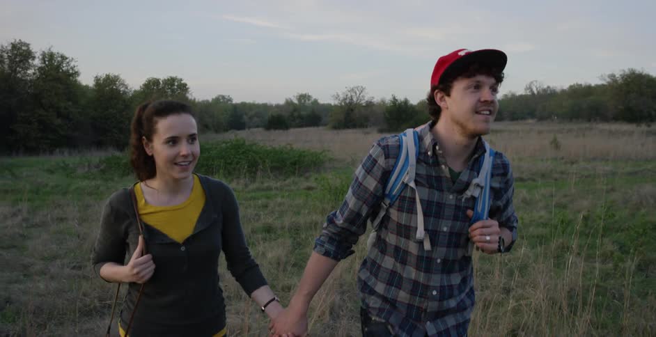 Man and woman are outside in the nature talking a walk