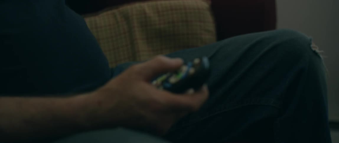 A man is using a remote control