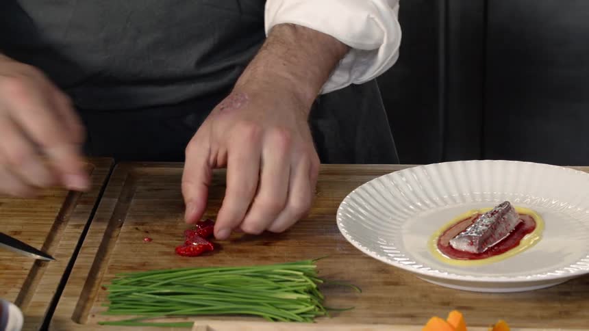 Chefs Preparing Food In Kitchen