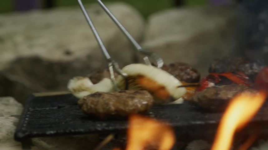 Man Cooking On The Grill
