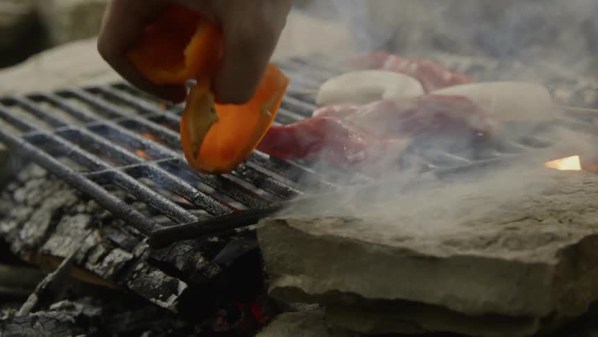 Man Cooking On The Grill