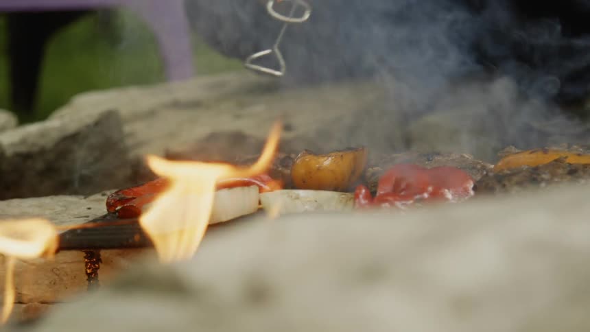 Man Cooking On The Grill