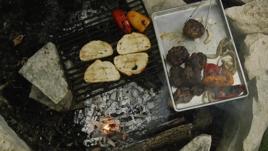 The grill is full of different foods