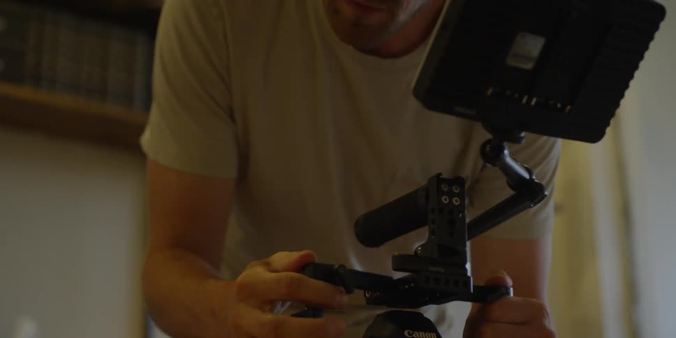 Man adjusts an electronic device