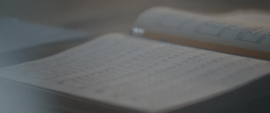 A book sits open on a table
