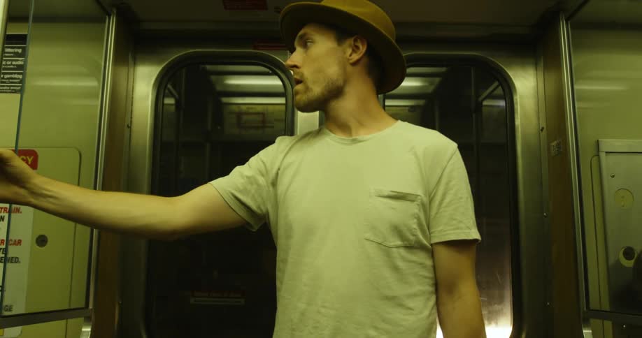 Man rides on the subway at night
