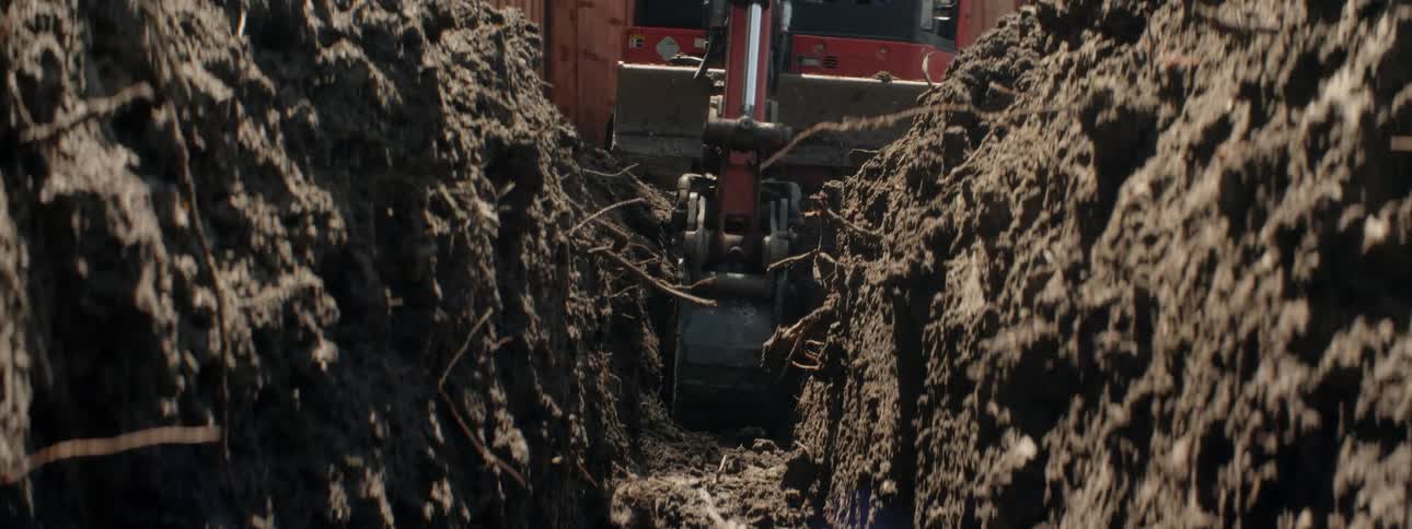 The trench is nearly dug by the vehicle