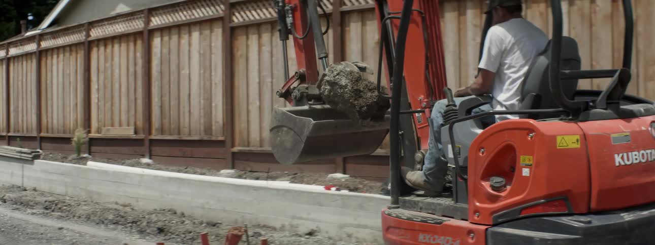 An excavator is operated at a construction site