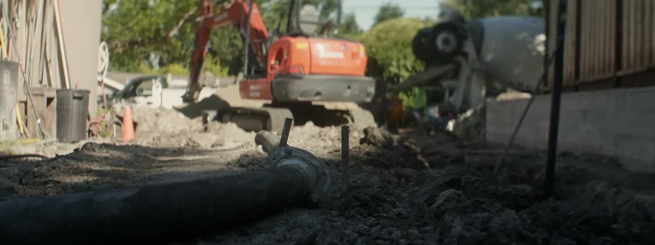 Heavy machinery sits at a construction site