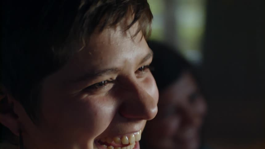 Woman wearing a hoop earring laughs