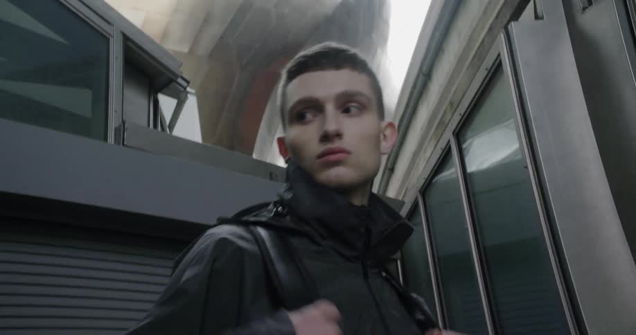 A man poses in a jacket