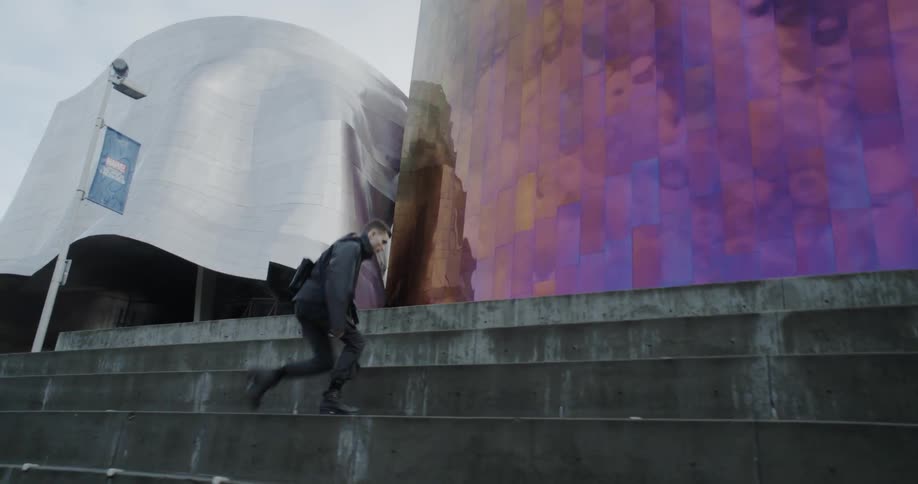 A man climbs up city steps
