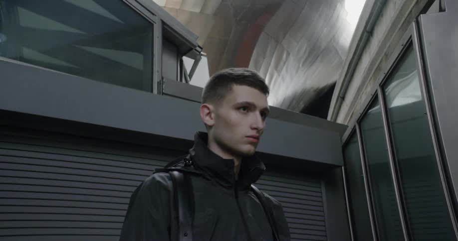 A man poses in a jacket