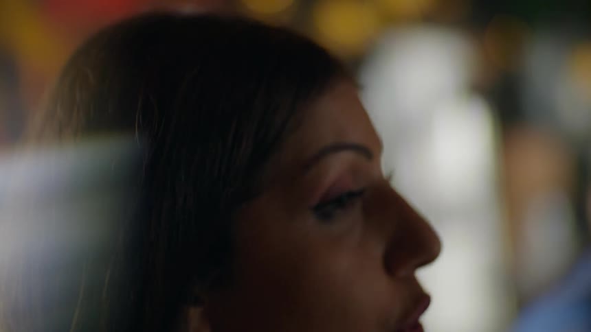 A woman is talking and smiling