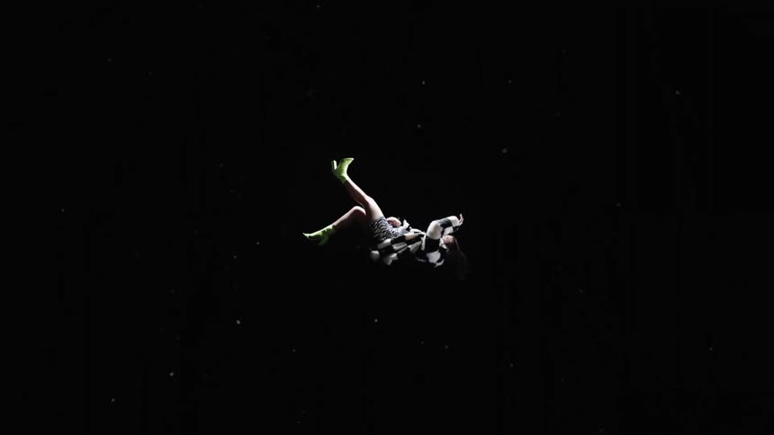 A woman is suspended in air