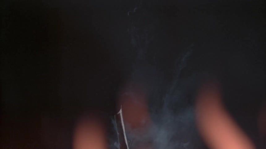 The hot piece of metal falls in the fire