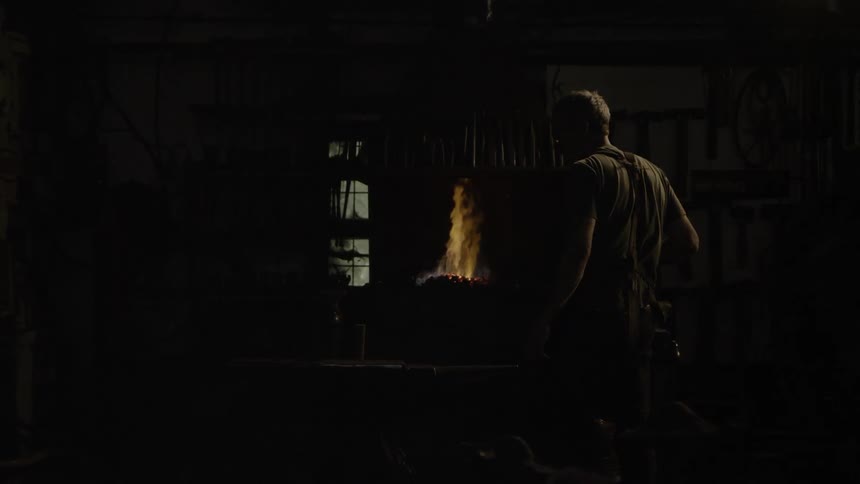 Blacksmith In Workshop