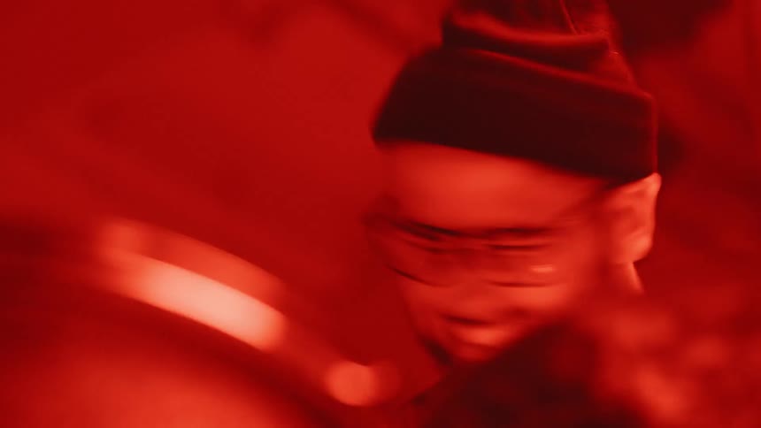Man shakes his head as he drums