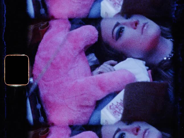 The woman is laying with her eyes open