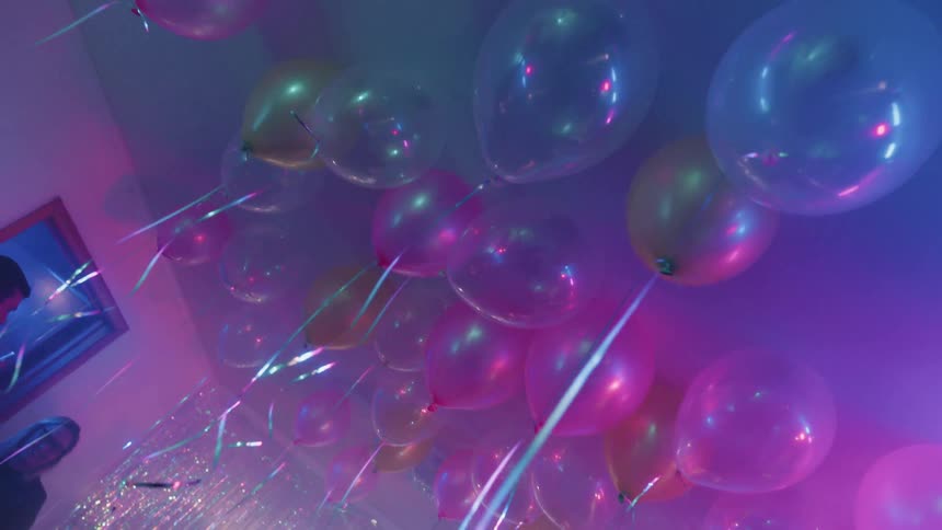 The balloons all line the ceiling