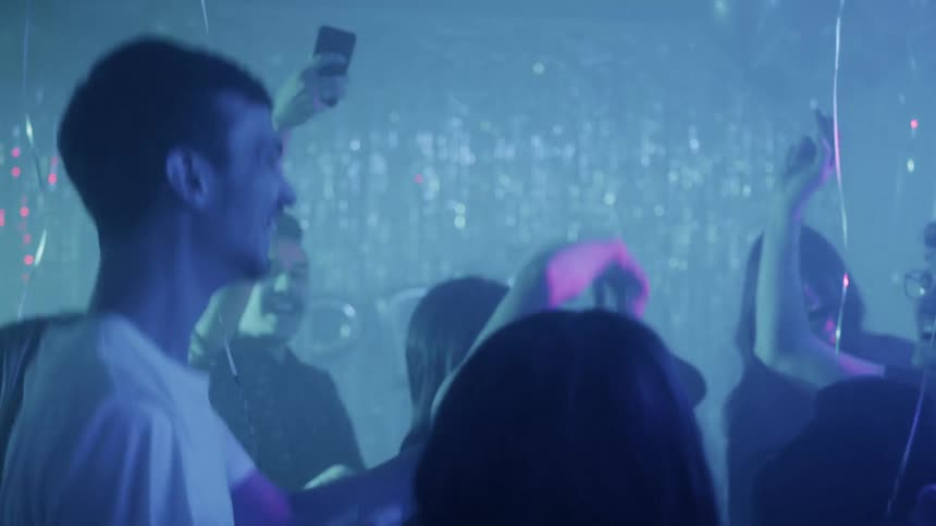 People dance at a party