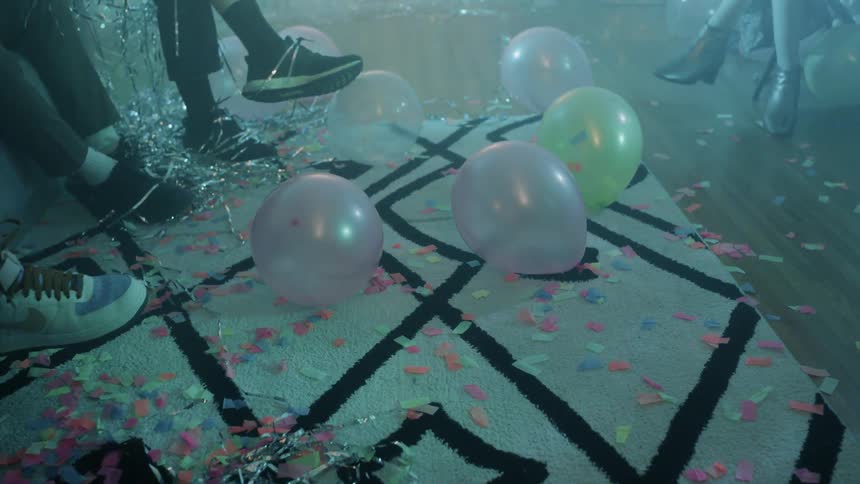 The lights flash on the balloons on the ground