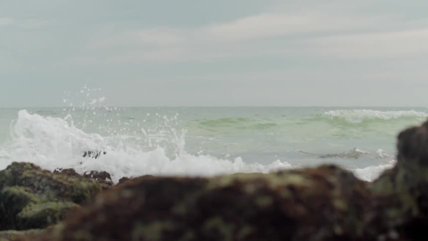 Waves crashing ashore on a rocky beach