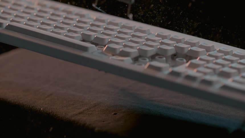 A hammer hits a keyboard