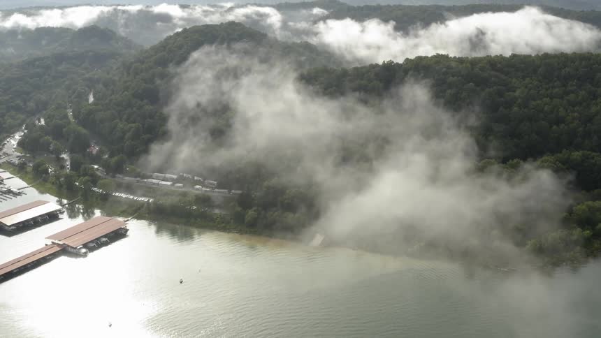 Clouds float above a mountain lake