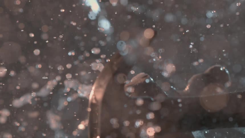 Hammer smashes a snow globe