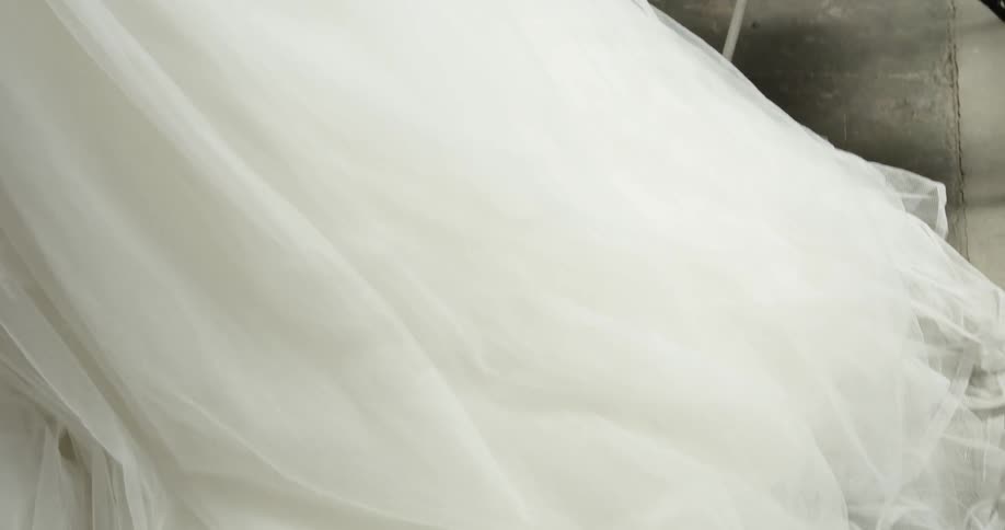 A close up shot of a wedding dress