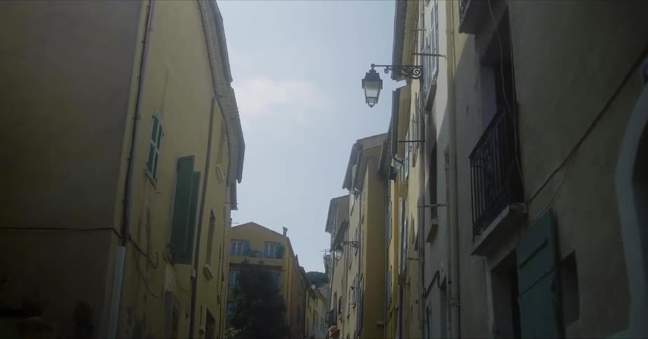 The alley is lined with tall homes