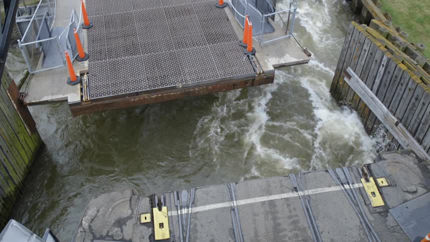 The bridge is opening as the waves crash