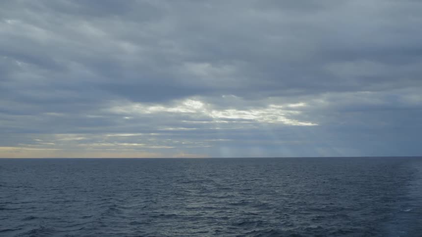 There are heavy clouds above the ocean