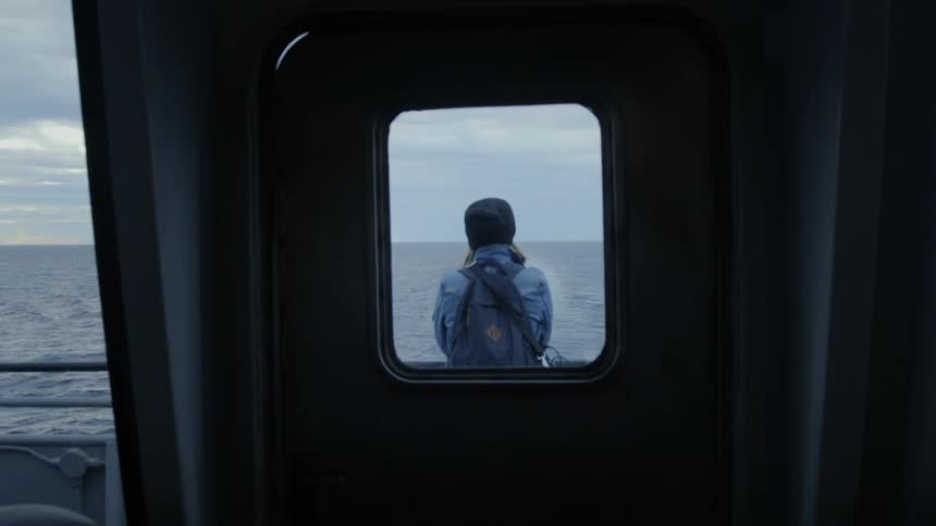 The person is right outside the door of the ship