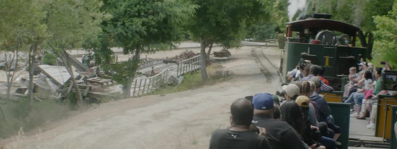 People Riding Steam Train