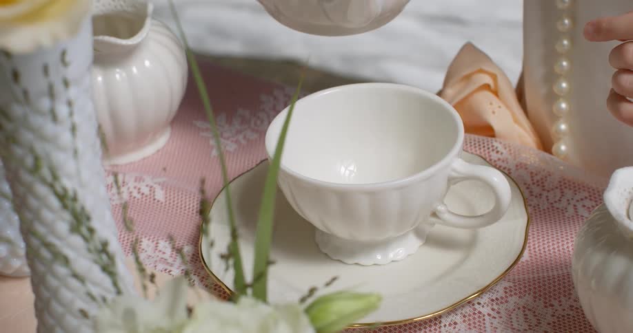 Girl Having Tea