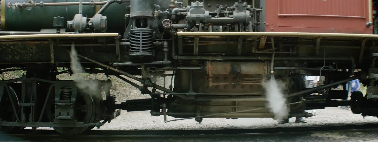 Steam blows from a train engine