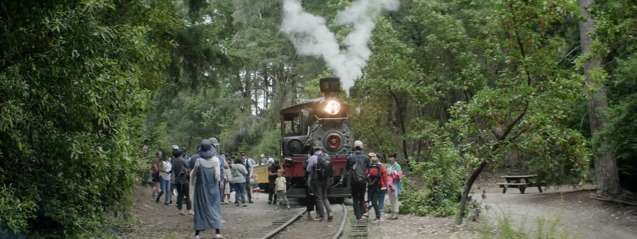 People Riding Steam Train