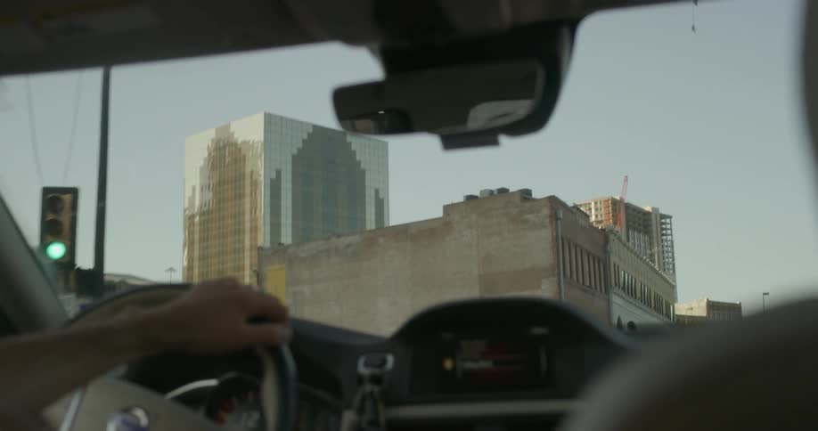 A car is driven on a city street