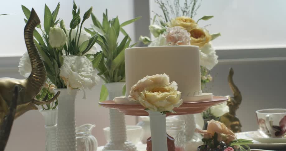 A table near a window with flowers all over