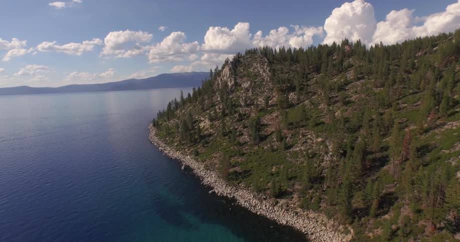 Flying over a lake and above the shoreline