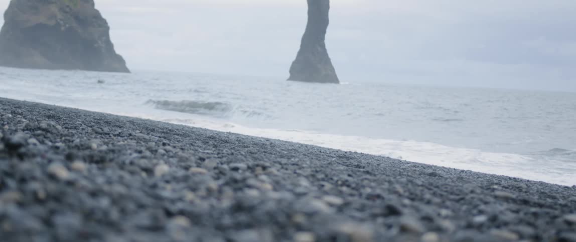 The waves rash on the pebbles of the beach
