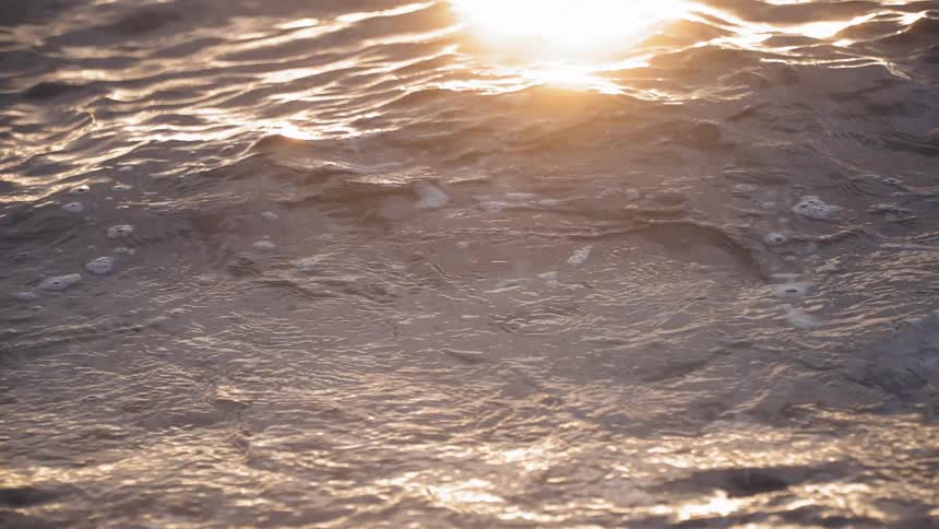 The waves move with the light reflecting from the sun